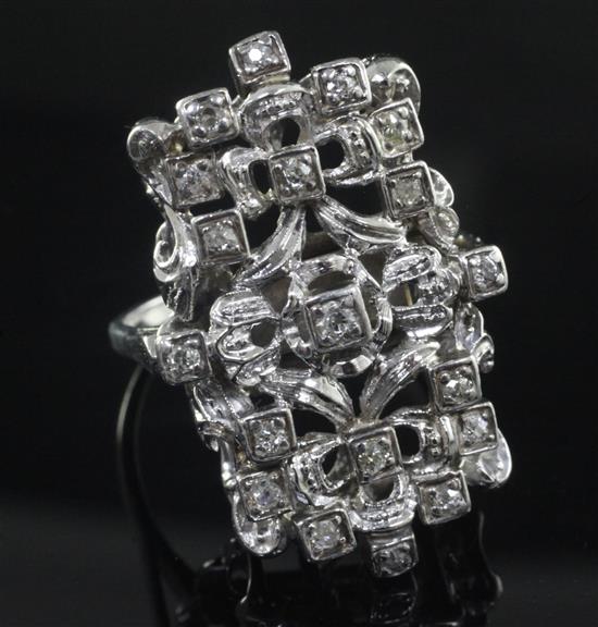 An 18ct white gold and diamond set modernist dress ring, size V.
